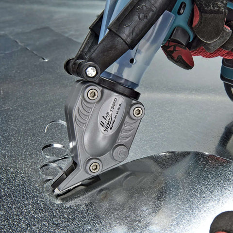 Close-up of Double Cut TurboShear Attachment for drills cutting sheet metal, showing clean edges with power-assisted 18 gauge capacity.
