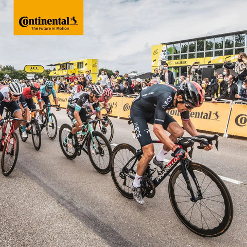 Cyclists racing in a group during a competition with Continental branding, showcasing Race Ready 28 Inch Inner Tubes 700x20-25c With 42mm Presta