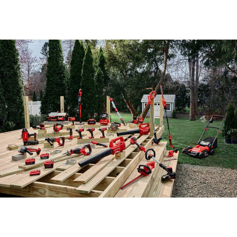 Variety of power tools including 20V Max Cordless Drill Driver With 1/2 Inch Keyless Chuck displayed on wooden framework outdoors.