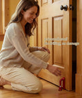 Woman installing Portable Door Stopper For Inward Swinging Doors No Drill Installation Grab And Go Travel Security Brace Red