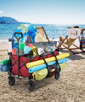 Heavy Duty Collapsible Outdoor Utility Wagon With Oversized 36 By 21 By 15 Bed And 150 Pound Capacity Red Foldable Rolling Cart With Cup Holders And Pockets for beach use