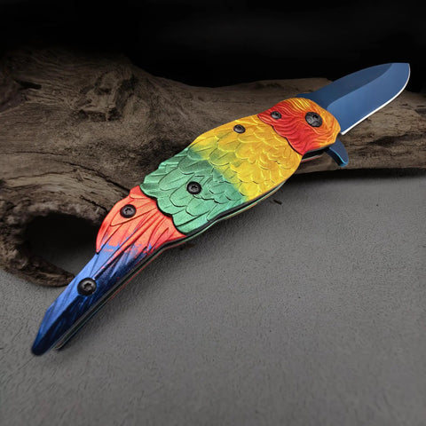 Colorful Parrot Pattern Folding Pocket Knife With Gradient Parrot-Scale Handle, 3-Inch Blue Coated Blade, 7.7 Inch Overall, Lightweight EDC Utility Knife For Camping, Outdoor Tasks, Daily Carry on rustic background