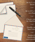 Vintage Airmail Mini Stationery Set With Fifty Lined Sheets And Fifty Matching Envelopes, Five And A Half By Eight And A Quarter Inches, Double Sided Printing, Double Side Lined Paper, Great For Notes And Letters on a wooden desk with pen
