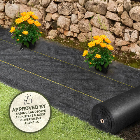 Pro 5 Weed Barrier Fabric 5 Oz Heavy Duty Ground Cover Mat 3 x 250 ft installed with flowers on landscape