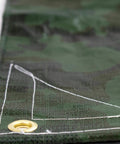 Close-up of Rugged Camo Tarp 20ft By 30ft Heavy Duty Outdoor Shelter with brass grommet, reinforced corner, and rope hem.