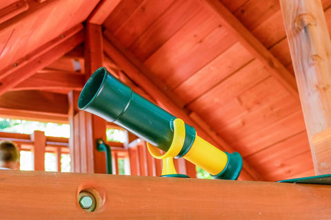 Green and Yellow Telescope Playset Attachment With 360 Degree Spin for Kid Friendly Outdoor Adventures Durable Polyethylene Build Easy Mounting Kit Included Sparks Imagination and Endless Backyard Explorations mounted on wooden playset
