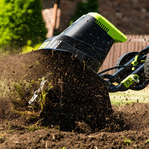 Corded Electric Garden Tiller Cultivator with 12.5 Amp Motor, 16 Inch Tilling Width, and Six Steel Tines in action, black.