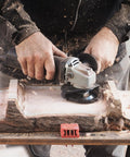 Person using TurboPlane Carbide Woodworking Blade For Angle Grinders, 4 Inch Disc Attachment on a wooden surface