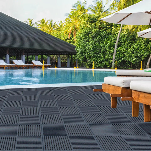 9 Pack 12 Inch Square Interlocking Floor Tiles With 0.4 Inch Thick Dark Gray Non Slip Mats And Drainage Grooves For Pool Deck Shower Bathroom Garage Boat And Other Wet Areas Highly Grippy And DIY Friendly by a poolside view