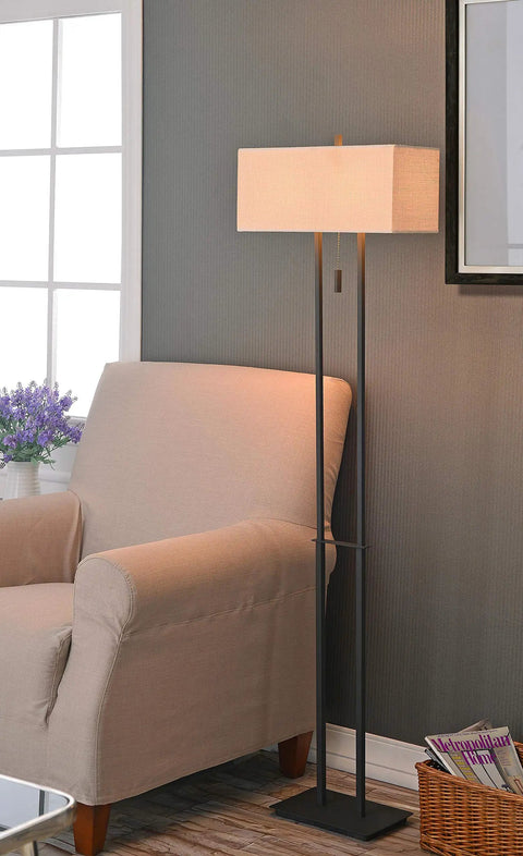 Emilio Floor Lamp With Bronze Finish In Prairie Style Box Frame And Tan Rectangular Drum Shade next to beige armchair