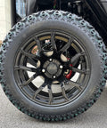 Top Notch Four Passenger Electric Golf Cart With One Touch Start And 48V 150Ah Lithium Battery tire and wheel close-up, showcasing rugged design.