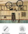 Road Bike Hooks For Garage Walls And Ceilings Heavy Duty Bicycle Hangers For Safe Space Saving Bike Storage No Drill Large Ceiling Hooks For Hanging Bikes And Plants Wall And Ceiling Mount Options mounted on a garage ceiling holding a bicycle.