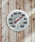 Wireless Indoor Outdoor Dial Thermometer With An 8 Inch Display For Patio Pool And Indoor Use Weather Resistant White Shows Easy To Read Large Numbers From Minus 60 To 120 Degrees Fahrenheit. White round dial thermometer mounted on wood wall, 8-inch display, red needle