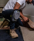 Person wearing Gel Stabilizer Knee Pads With Dual Layer Padding And Non Skid Grip working on flooring installation.