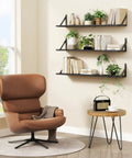 Legit Heavy Duty Floating Wall Shelves Set of Three, Slick 36 Inch by 8 Inch Black Bookshelf for Bedroom Living Room Office, displaying books and plants.