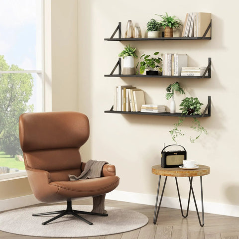 Legit Heavy Duty Floating Wall Shelves Set of Three, Slick 36 Inch by 8 Inch Black Bookshelf for Bedroom Living Room Office, displaying books and plants.