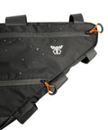 Full Frame Bike Bag For Bikepacking And Commuting Large 14L Three Size Options To Fit Most Touring And Fat Bike Frames Ride Ready Quick Access Gear Pocket Durable Water Resistant Construction, showing close-up of zipper details and water droplets on the fabric.