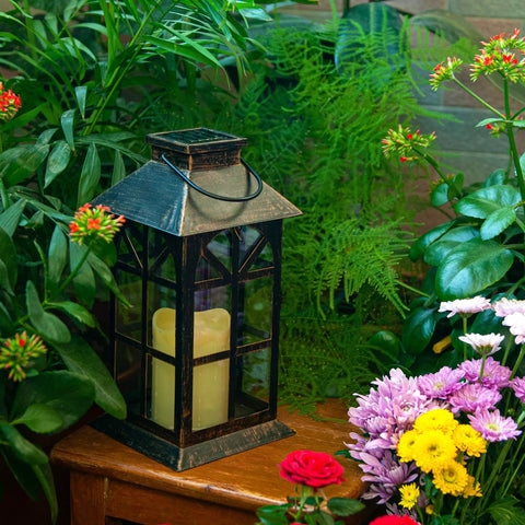 Solar Lantern Outdoor Waterproof Hanging Light For Garden Patio And Porch With Flickering LED Flames in a garden setting