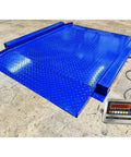 Heavy Duty Low Profile Drum Scale Built Tough With Smooth Hinged Ramps For No Sweat Barrel Rolling and Rock Solid Weighing Capability Up To 5000 Pounds With Spot On One Pound Accuracy NTEP Approved, blue steel finish.