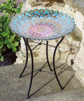 Handpainted Mosaic Flower Fusion Glass Pedestal Bird Bath For Outdoor Patio Garden Backyard Deck Decor, 21 Inch Height In Blue And Purple, Multi Functional Waterer Or Bird Feeder With Foldable Stand on stone patio.