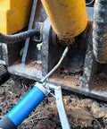 8000 PSI Heavy Duty Lever Action Grease Gun Kit With 14oz Aluminum Barrel in use on machinery