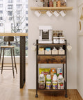 Compact Coffee Bar Cart With Secure Drawer And Hanging Mug Rack Real Cool Three Tier Station ideal for modern kitchen use.