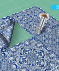 Rotary blade and drive housing for Maker 4/3, top-down view on blue-and-white patterned cardstock