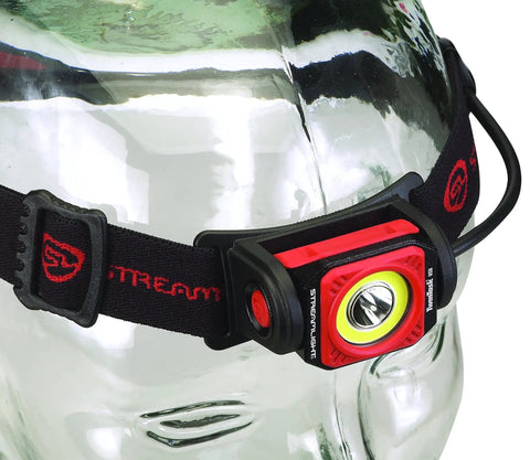 Twin Task 300-Lumen Headlamp With 3AA Batteries, red and black rubber strap, displayed on a glass head with adjustable elastic strap.
