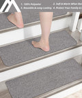 Person walking on Non Slip Stair Treads 15 Pack Carpet Mats For Indoor Stair Runners 28 By 9 Inches Grey 100 Percent Polyester With TPE Backing Protect Floors And Keep Kids And Pets Safe on indoor stairs