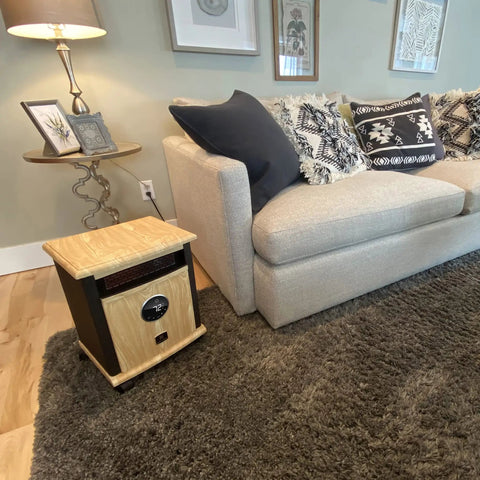 Portable Electric Space Heater That Cranks Up The Heat With 1500 Watt Infrared Quartz Elements next to beige sofa