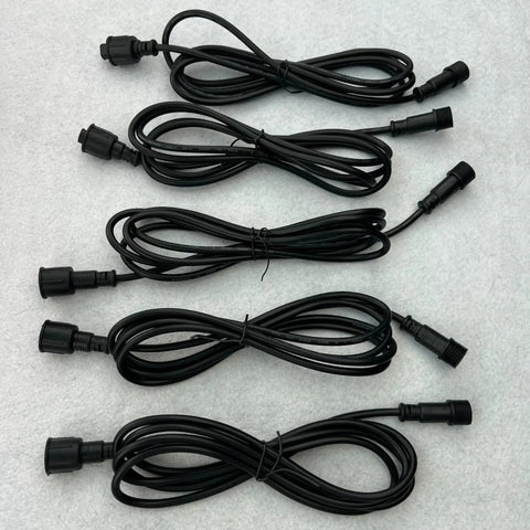 Straight Up Reliable 18 Awg Waterproof Extension Cord featuring secure male to female plugs, five segments laid out for camping use.