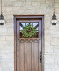 Onion Outdoor Pendant Light With One Bulb, Oil Rubbed Bronze Finish, hanging by a rustic door, 10x10x14 inch weatherproof design