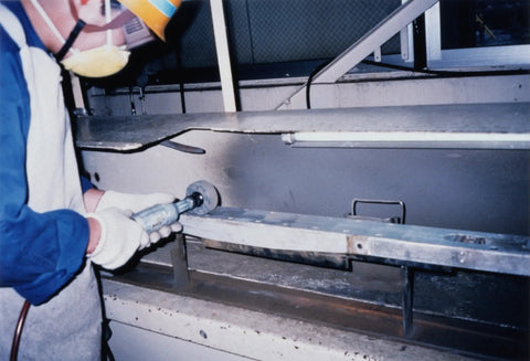 Worker using Unitized Silicon Carbide Wheel Pro Grade for Metal Deburring Finishing and Polishing, 2 Inch Diameter