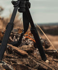 Rifle Bipod Gun Rest For Hunting And Target Shooting, MLOK Compatible, Ultralight Mil Spec Aluminum With Durable Polymer Feet on rocky terrain.