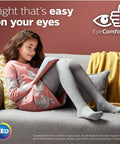 Girl reading on a sofa under Flicker Free LED BR30 Bulb 1400 Lumen Beast Bright Dimmable Warm Glow 2700K To 2200K lighting.