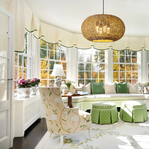 Large 22.83 Inch Rattan Boho Chandelier With Hand Woven Wicker, 4 Light Pendant Ceiling Fixture in a sunlit living room