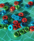 Colorful M3 counterbore washers in red, green, and blue anodized aluminum on a grid surface, perfect for RC Drone FPV use.