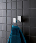 Selection Cube Robe Hook in Starlight Chrome Built Tough Durable Metal Bath Accessory holding a towel on tiled wall