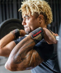 Man lifting weights wearing 18 Inch Adjustable Weightlifting Wrist Wraps For Men And Women Pair for stability and comfort.
