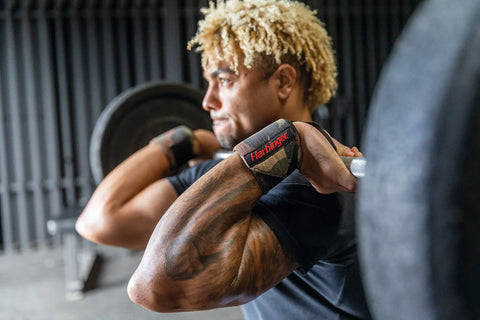 Man lifting weights wearing 18 Inch Adjustable Weightlifting Wrist Wraps For Men And Women Pair for stability and comfort.