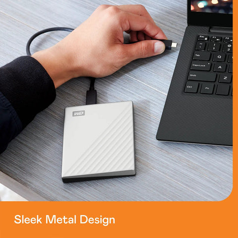 5TB My Passport Ultra For Mac Portable External Hard Drive With USB C And USB 3.1 connected to laptop, sleek metal design.