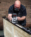 Woodworker using Pro Grade Two Flute Router Bit One Quarter Inch Shank One Half Inch Cut Diameter Tungsten Carbide Tipped