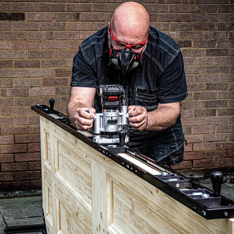 Woodworker using Pro Grade Two Flute Router Bit One Quarter Inch Shank One Half Inch Cut Diameter Tungsten Carbide Tipped