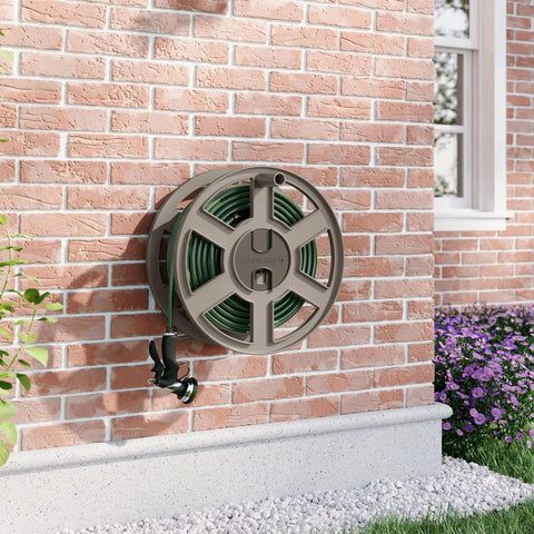 Wall-mounted 100 Ft Garden Hose Holder with Manual Retractable Sidewinder Hose Reel in taupe resin on a brick wall