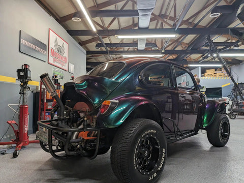 Fresh Shop Grade Superflake Colorshift Basecoat Paint Gallon Ready To Spray With Slow Reducer Binder For Custom Rigs Delivering Dope Shiftin Shades on a custom painted Volkswagen in a garage.