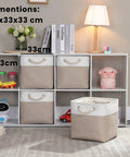 Slick Cube Storage Bins Ditch The Mess Fabric Baskets For Closets And Shelves Foldable Organizer Containers A Clutch Home Stash Box In Light Khaki 13 Inch 3 Pack displayed in a stylish storage unit with toys.