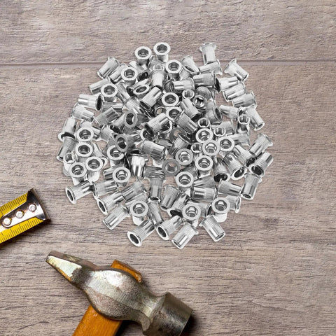 Heavy Duty Stainless Steel Flat Head Knurled Rivet Nuts Kit With 1 4 20 Thread Inserts 120 Pieces on wooden surface with tools