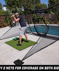 Golfer practicing with Shank Net Attachment For Golf Hitting Nets Catches Errant Shots Left Or Right Handed And Fits 10x7 And 7x7 Foot Nets Attaches Securely To Stop Shanks And Hosels In Backyard Practice Black by swimming pool.