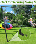 Children swinging on set with 12 Inches Trampoline Wind Stakes Heavy Duty U Stakes For Ground 8 Pack Trampoline Tie Down Anchor Kit