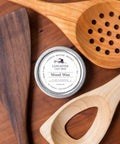 Must Have Everyday Wood Care Wax For Spoons Cutting Boards And Butcher Blocks With Beeswax And Mineral Oil Conditioner Two Oz Wood Butter To Hydrate Restore And Protect Woodenware Made In USA tin next to wooden utensils